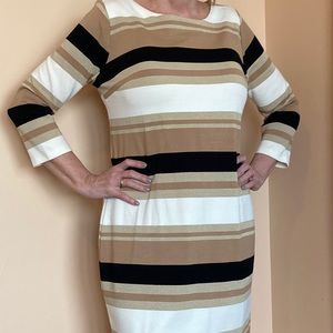 Figure flattering shimmer dress.